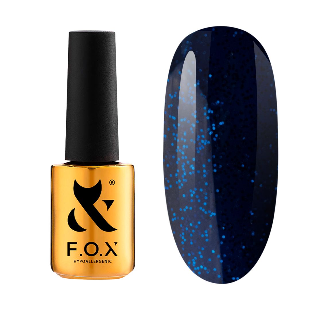 F.O.X gele neglelakk i midnattsblå nyanser med glitrende turkise prikker.